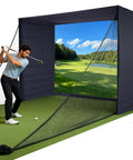 Golfer swinging inside Golf Simulator Enclosure With Double-Layer Silent HD Impact Screen And Side Barriers, 10 By 8 Ft Indoor Hitting Cage With 32mm Thick Stainless Steel Frame For Garage-Ready Home Practice.
