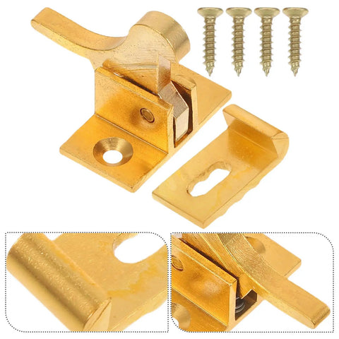 Close-up of brass cabinet door latch with spring catch and mounting screws; old school retro style window security lock.