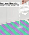 Pouring water on Purple Green Wood Grain Print Microfiber Dish Drying Mat For Kitchen Counter Super Absorbent And Machine Washable Dish Drying Pad Rack Mat 16 By 18 Inches Quick Dry Kitchen Counter Essential