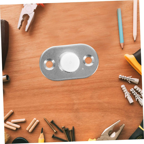 Sliding Door Floor Guide Roller And Barn Door Stopper hardware piece on wooden surface with tools around