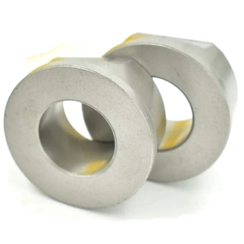 Two metal bushings from Heavy Duty Front Wheel Bearing Replacement Kit With Four Bushings Two 121748X Two 121749X Thrust Washers And Clips