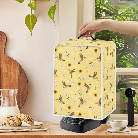 Slick Hummingbird Floral Coffee Maker Cover on a black coffee machine, features waterproof polyester and heavy-duty handle.