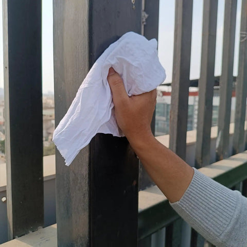 Hand using Bulk White Cotton Cleaning Rags Recycled T Shirt Rag Pack 5 Lb Compressed Box For Oil Grease Paint Stain Cleanup Auto Care