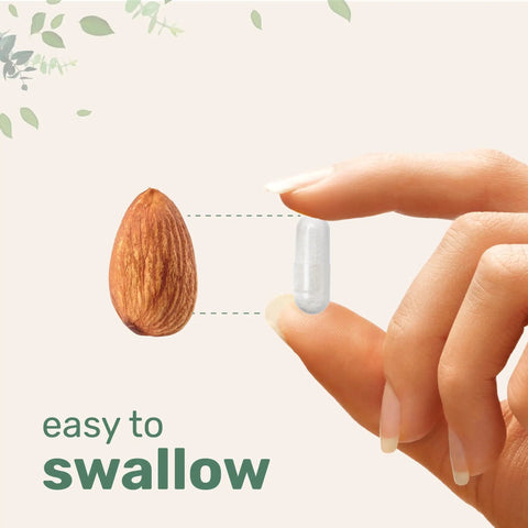 Hand holding a vegetarian capsule next to an almond, showcasing size comparison for Lithium Orotate 5mg for Everyday Balance, 240 Vegetarian Capsules