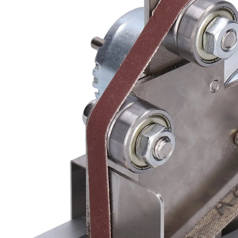 Close-up of Jauarta Mini Belt Sander Grinder Aluminum Alloy Polishing Machine 9000RPM showing belt and bearings for precise grinding.