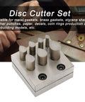 Pro Grade Disc Cutter Set For Jewelry Making, showing 7 size punch die plates with flat bottom on a workbench.