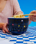 Dope Retro Maze Ramen Dinnerware Set With Ceramic Bowl And Bamboo Chopsticks, 20-Ounce Noodle Bowl For Retro Gamer Kitchens And Everyday Meals At Home on blue checkered table