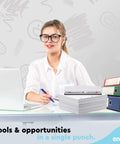 Person at desk with Heavy Duty 3 Hole Punch For Binders, laptop, and binders in office setting.