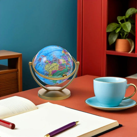 Rotating Desktop Globe With Stand 14.2cm Blue Frame Educational World Sphere on office desk with cup and plant