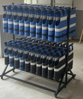 Rock Solid Commercial Life Vest Display Rack On Smooth Brake Wheels For Poolside Deck Marine Rescue Gear Storage Organizer With Top Shelf Steel Frame, holding blue and black vests.