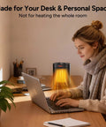 Ceramic Personal Space Heater For Office Desk And RV next to woman using laptop, illustrating fast 3 second ceramic instant heat.