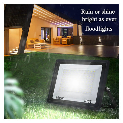 JUDYSSY Led Flood Light 100W IP66 Waterproof outdoor spotlight illuminating garden area at night.