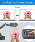 Autofocus Document Camera demonstrating 4K USB visuals with hands holding a flower, showcasing controls for ease of use.