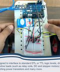 L293D Four Channel Motor Driver Module DIP16 for Arduino DIY projects on a breadboard with wiring and components
