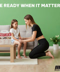M2 BASICS 321-piece first aid kit in white hard case on living room coffee table; logo visible.