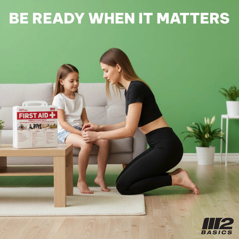 M2 BASICS 321-piece first aid kit in white hard case on living room coffee table; logo visible.
