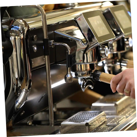 Close-up of espresso machine with steam wand insulation cover for espresso machine heat sleeve replacement kit in use.