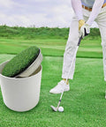 Golfer practicing with metal base golf hole cups for home putting practice, realistic lawn look, standard size on green turf.