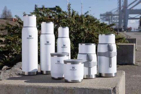 Assorted white stainless steel containers including the Adventure To Go Food Jar And Spork 36 Oz Vacuum Insulated Food Container