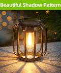Outdoor Solar Lanterns Pack Of 4 Waterproof Metal Hanging Lights casting warm glow and shadow on table.