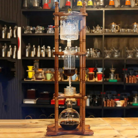 Huge 3 Liter Cold Brew Coffee Maker Serves 25 Cups Of Smooth Iced Tea And Bold Drip Coffee With Zero Hassle Setup showing wooden frame with brewing apparatus.