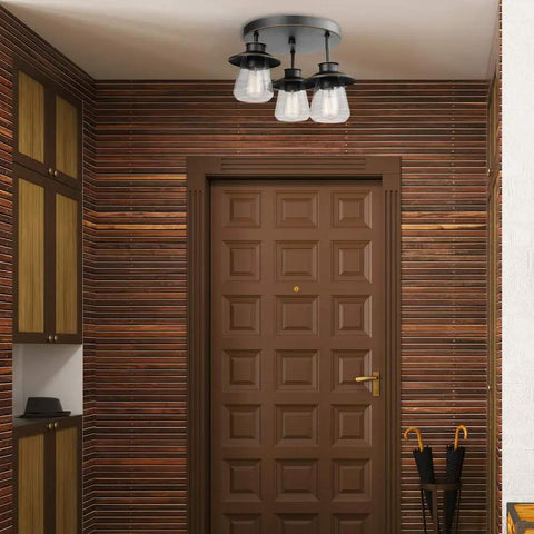 Sedona Modern Farmhouse Pendant with faux wood accents and clear glass shades, matte black finish, mounted on hallway ceiling.