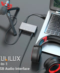 USB Audio Interface For Recording, Streaming, And Podcasting With 5 In 1 Hub connected to laptop, microphone, and headphones