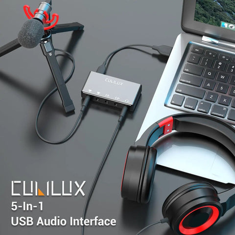 USB Audio Interface For Recording, Streaming, And Podcasting With 5 In 1 Hub connected to laptop, microphone, and headphones