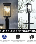 Outdoor Post Light With Clear Glass Panels In Sleek Black Finish Perfect For Patio Porch Driveway Garden And Walkways Modern Durable Exterior Lamp That Elevates Yards And Pathways With Bright Welcoming Glow And Curb Appeal, shown in rain and snow conditions.