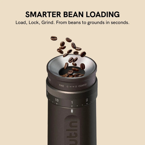 Fino Portable Electric Coffee Grinder With 28 Grind Settings For Espresso To French Press, shown with coffee beans being loaded.