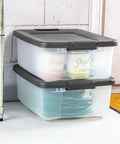 18 Pack Plastic Storage Bins With Lids 25 Quart Gray Shelf Totes Heavy Duty Durable Clear Containers Fits Standard Shelving Made In Usa stacked on a floor, holding supplies.