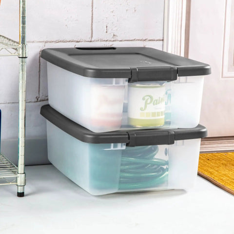 18 Pack Plastic Storage Bins With Lids 25 Quart Gray Shelf Totes Heavy Duty Durable Clear Containers Fits Standard Shelving Made In Usa stacked on a floor, holding supplies.