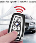 BMW Key Fob Cover With Soft TPU Case Advanced Silver Key Box For X1 X3 X5 X6 And More in hand, signal icon visible