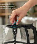 Hand adjusting lid on Replacement Glass Coffee Carafe For 12 Cup Coffee Makers With Black Handle Compatible With CM1160B CM0960BF