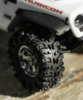 Close-up of 36x14mm 0.7 Inch Swamp Claw RC Tires for 1/30 Axial SCX30 with soft sticky S5 compound on rocky terrain