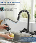 HURRAN Wall Mount Kitchen Faucet with Pull Down Sprayer, Matte Black Kitchen Sink Faucet, 8 Inch in use, washing a fruit.
