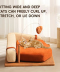 Cat lounging on Modern Wooden Pet Hangout Haven With Swinging Toy, Built Like A Tank Oak Veneer Sofa Bed, Ultra Comfy High Resilience Foam Cushion.