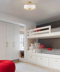 15 Inch Modern Gold Semi Flush Mount Ceiling Light With White Fabric Drum Shade in a cozy bedroom with bunk beds