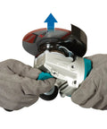 Hands operating Beast Mode Brushless 18V LXT Cordless Angle Grinder With X LOCK Four And A Half Inch And Five Inch Wheel Tool Only Renewed