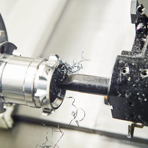 Quarter Inch Shank Lathe Indexable Boring Bar Holder S06KSCLCR06 in use with metal lathe, showing cutting process on steel piece