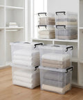 Sleek Clear Plastic Storage Bins With Secure Lids 90 Quarts 8 Pack used for organizing towels in a modern home.