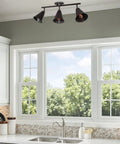 Ellis 27 Inch Industrial 3 Light Track Lighting With Adjustable Heads, oil-rubbed bronze, mounted above kitchen window