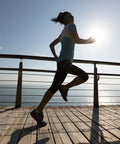 Runner on boardwalk near handrails with 1/8 Inch Black Stainless Steel Cable Railing Wire, 150 Ft Long, 7x7 Strand, Rustproof