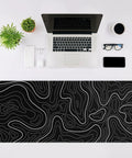 Beastly Ultra Wide Gaming Mouse Pad XL 31.5 By 11.8 Inches With Anti Slip Rubber Base For Keyboard And Mouse Desk Protector Mat In Black With White Topographic Line Perfect For Home Office And Serious Gaming Setups on desk with laptop.