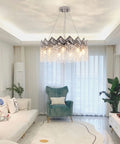 Dope Modern K9 Crystal Chandelier With Nine Lights Raindrop Pendant Ceiling Light Chrome Finish 23.6 Inch in living room setting