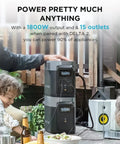 Person using Delta 2 Smart Extra Battery 1024Wh LiFePO4 Expansion for Power Station Delta 2 at outdoor picnic setup