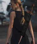Person wearing Two Piece Black Katana Sword Bag Kit with Back Strap, featuring nylon holder for cosplay or Halloween.