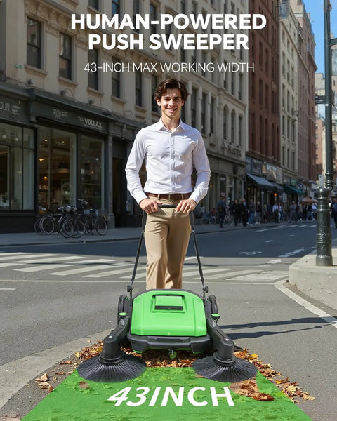 Heavy Duty 43 Inch Industrial Walk Behind Push Floor And Lawn Sweeper clearing leaves in an urban street setting.