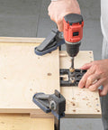 Person using 3 In 1 Woodworking Drill Locator And Self Centering Doweling Jig For Cabinet And Furniture Assembly With 6Mm 8Mm 10Mm Drill Adapters