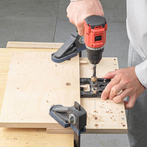 Person using 3 In 1 Woodworking Drill Locator And Self Centering Doweling Jig For Cabinet And Furniture Assembly With 6Mm 8Mm 10Mm Drill Adapters
